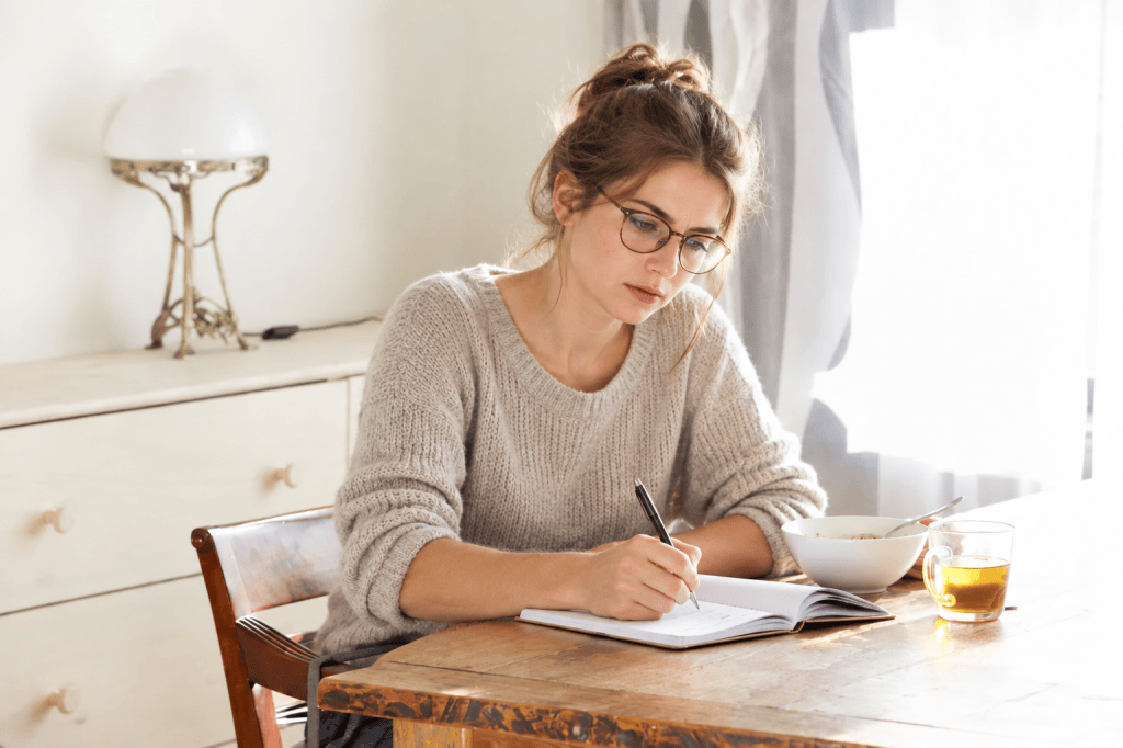 Woman considering which publishing company to submit to.